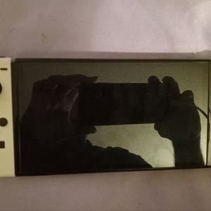 Nintendo Switch (Oled Model) with 1 game (Super Mario Brothers V Deluxe)